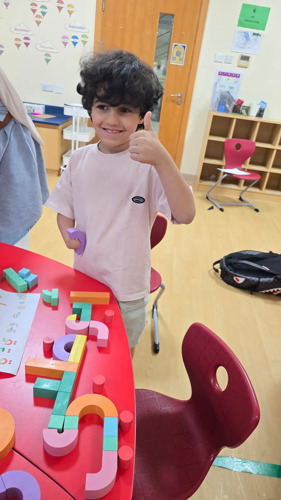 A ZSkills learner giving a thumbs-up after building Arabic words