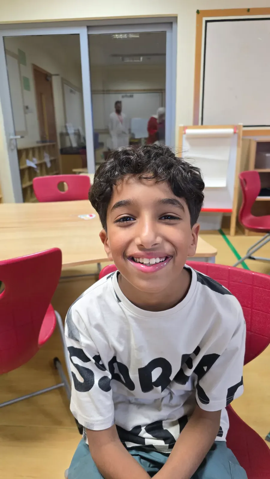 A smiling ZSkills learner during a guided activity